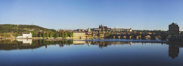 Panorama view of Charles bridge over Vltava river and Gradchany (Prague Castle) and St. Vitus