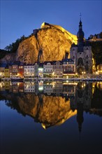 Night view of Dinant town, Collegiate Church of Notre Dame de Dinant over River Meuse and Pont