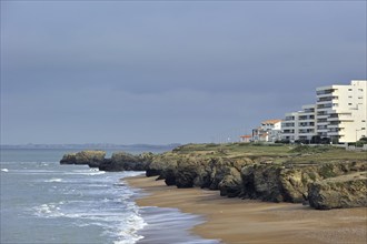 Apartments and rocky coastline at Saint-Hilaire-de-Riez, La Vendée, Pays de la Loire, France,