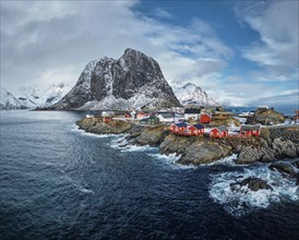 Hamnoy fishing village with red rorbu houses in Norwegian fjord in winter. Lofoten Islands, Norway,