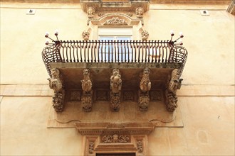 Old town of the late Baroque city of Noto in the Val di Noto, balcony at Palazzo Nicolaci di