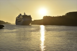 Cruise ship Insignia at sunrise in the Kiel Canal, Germany, Europe