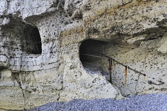 Trou à l'Homme, a passage tunnelling through the chalk cliff Porte D'Aval at Etretat, Côte