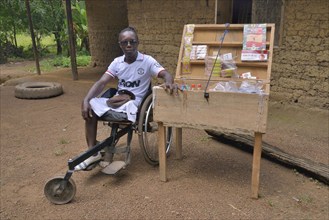 Amputee sitting in for his mobile shop, Motema Amputee Camp, Koidu, Koidu-Sefadu, Kono District,