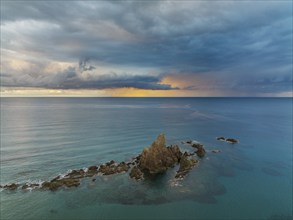 The reef Arrecife de las Sirenas in the Nature Reserve Cabo de Gata-Nijar, at sunrise with heavy