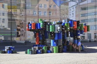 In the historic centre of Nuremberg, art with barrels in front of the Neues Museum Nuremberg, State