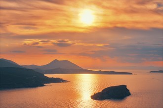 Aegean Sea with Greek islands view on sunset. Cape Sounion, Greece, Europe