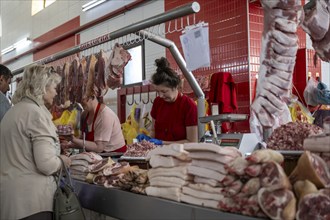 Butcher selling fresh meat, market at Osh Bazaar, Bishkek, Kyrgyzstan, Asia