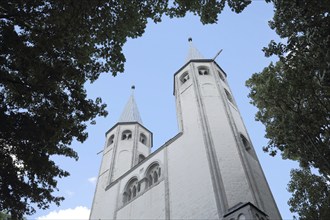 Towers of the Romanesque Neuwerk Church with perspective and view upwards, Goslar, Harz, Lower