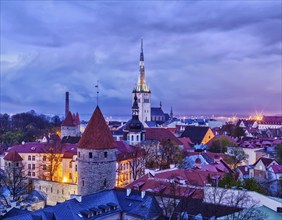 Aerial view of Tallinn Medieval Old Town with St. Olaf's Church and Tallinn City Wall illuminated