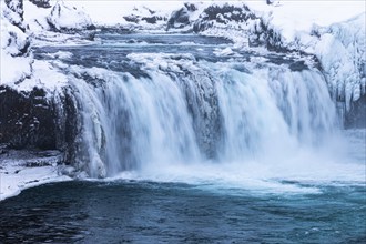 Godafoss waterfall, icy and snowy rock face, Northern Iceland Eyestra, Iceland, Europe