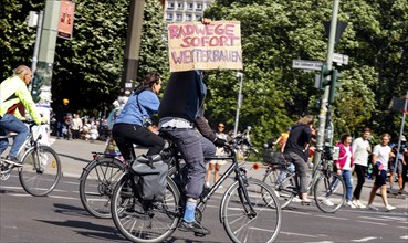 Cycling and environmental organisations demonstrate against transport policy. The bicycle