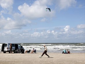 Family with a camper on the beach, sail of a kite surfer, Vejers, Denmark, 17.07.2023, Europe