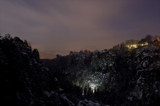 Bastei rock at full moon in winter