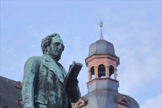 Jesuit Square with monument to physician Johannes Müller 1801-1858 and spire of the Jesuit Church,