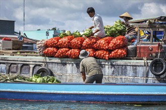 CAN THO, VIETNAM, 4 JUNE, 2011: Unidentified people at floating market in Mekong river delta. Cai