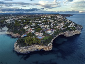 Sunset over Cala Anguila-Cala Mendia from a drone, Porto Cristo, Majorca, Spain, Europe