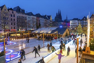 Ice rink at the Christmas market on the Heumarkt in the old town of Cologne, Cologne Cathedral,