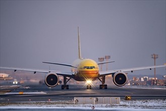 DHL, AeroLogic, Boeing 777F, on the taxiway to Runway West, Frankfurt FRA Airport, Fraport, in