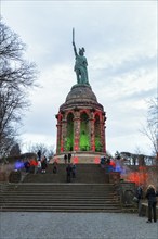 Pedestrians in front of Hermannsdenkmal, illuminated, dusk, Teutoburg Forest, Detmold, North