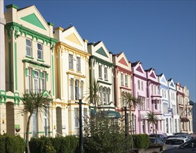 Colourfully painted guesthouses and hotels on the Esplanade, Paignton, Devon, England, UK