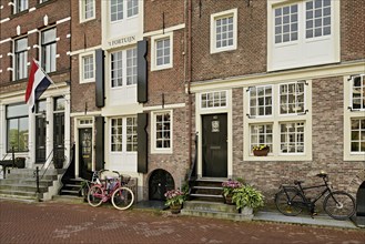 Bicycles in front of historic buildings, Herengracht 43, Amsterdam, Province of North Holland,