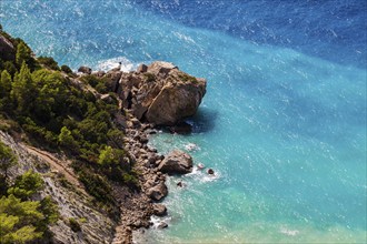 Boulders in turquoise-coloured water at Cap Blanc, Ibiza, Balearic Islands, Mediterranean Sea,