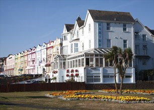 Colourfully painted guesthouses and hotels on the Esplanade, Paignton, Devon, England, United