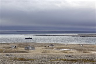 Wooden shacks and cabins at deserted 1950s Kinnvika Arctic research station, Murchisonfjord,