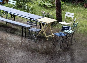 Flooded garden with tables and chairs, Berlin, 23 06 2023