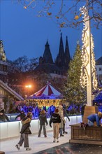 Ice rink at the Christmas market on the Heumarkt in the old town of Cologne, Cologne Cathedral,