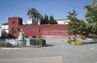 Moorish red castle walls in Plaza de la Constitucion, Alhama de Granada, Spain, Europe