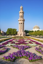 Sultan Qaboos Grand Mosque, minaret with blooming flowers in gardens, Muscat, Oman, Asia