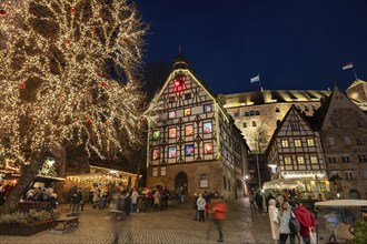 Historic Pilkatushaus with an Advent calendar on 18 December 2024 at dusk, behind the Imperial