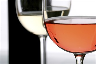 Two wine glasses filled with red wine and white wine, still life, studio