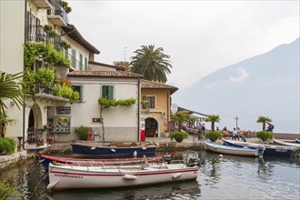 Old harbour with boats of Limone sul Garda, Lake Garda, Province of Brescia, Lombardy, Northern