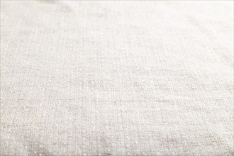 Fragment of smooth white linen tissue. Side view, natural textile background and texture