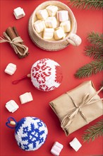 Christmas or New Year composition. Decorations, box, cinnamon, knitted balls, fir and spruce