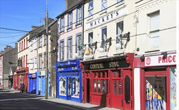 Colourful shops and pub historic high street buildings, Youghal, County Cork, Ireland, Irish