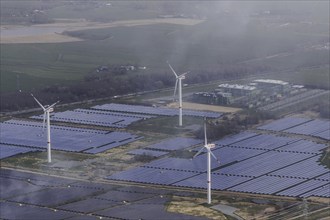 Aerial view of wind turbines and solar installations, taken near Wischhafen, 25/03/2024