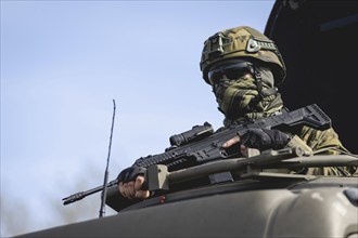 A Czech soldier occupies the hatch of a vehicle as part of the military exercise 'Wettiner Schwert'