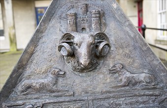 Pyramid sculpture three sided artwork showing horned ram sheep face, Devizes, Wiltshire, England,