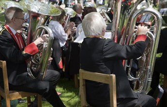 Musicians in a brass band perform during a country fair at Helmingham Hall, Suffolk, England,