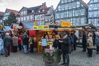 People at stalls at Christmas market in Celle, Lower Saxony, Germany, Europe