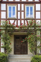 Wooden door, half-timbered house, windows, climbing roses, stairs, facade, Oppenweiler,