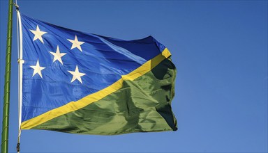 The flag of Solomon Islands, Solomon Islands, island nation in the South Seas, flutters in the