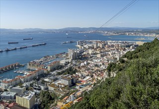 View of the city of Gibraltar and cable car near the top of the Rock of Gibraltar