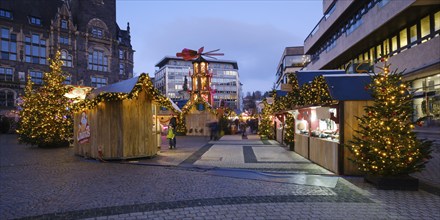 Stalls, Christmas trees and Christmas pyramid at the Christmas market at Neumarkt, Blue Hour,