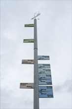 Mast showing the storm surge heights of past centuries, harbour, Greetsiel, East Frisia, Lower