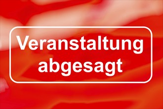 VERSTALTUNG ABGABAGT lettering against a red background